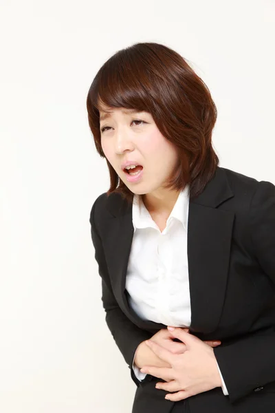 Businesswoman suffers from stomachache　 — Stock Photo, Image